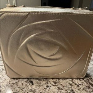 Fabulous gold Lancôme bag.